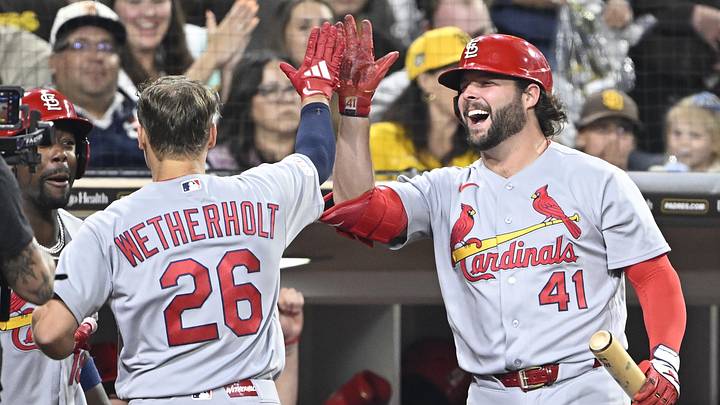 May 8, 2026; San Diego, California, USA; St. Louis Cardinals second baseman JJ Wetherholt (26) is congratulated by first baseman Alec Burleson (41) after scoring during the fifth inning against the San Diego Padres at Petco Park. Mandatory Credit: Denis Poroy-Imagn Images