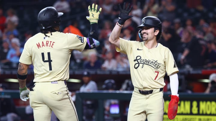 Jun 25, 2024; Phoenix, Arizona, USA; Arizona Diamondbacks infielder Ketel Marte (4) celebrates with teammate Corbin Carroll (7) after hitting a two-run home run in the first inning against the Minnesota Twins at Chase Field. Mandatory Credit: Mark J. Rebilas-USA TODAY Sports