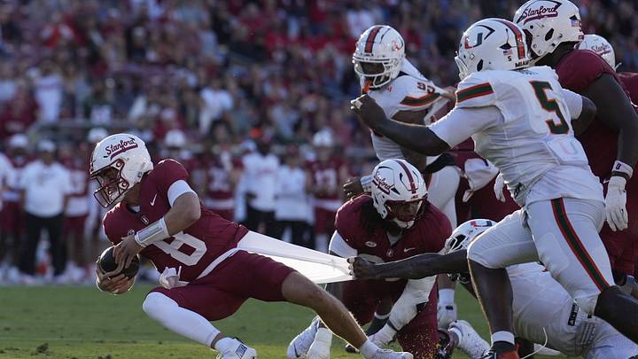 Sep 4, 2026; Stanford, California, USA; Stanford Cardinal quarterback Davis Warren (8) is sacked by
Miami Hurricanes defensive line Armondo Blount (18) during the first quarter at Stanford Stadium. Mandatory Credit: Stan Szeto-Imagn Images Sep 4, 2026; Stanford, California, USA; Stanford Cardinal quarterback Davis Warren (8) is sacked by
Miami Hurricanes defensive line Armondo Blount (18) during the first quarter at Stanford Stadium. Mandatory Credit: Stan Szeto-Imagn Images