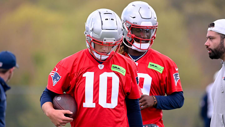 May 11, 2024; Foxborough, MA, USA; New England Patriots quarterback Drake Maye (10) (front) and New