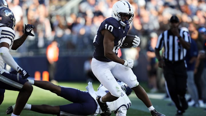 Penn State Nittany Lions running back Nicholas Singleton (10) avoids a tackle while running with the ball during the third quarter against the Nevada Wolf Pack at Beaver Stadium. Penn State Nittany Lions running back Nicholas Singleton (10) avoids a tackle while running with the ball during the third quarter against the Nevada Wolf Pack at Beaver Stadium.