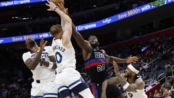 Jan 4, 2025; Detroit, Michigan, USA; Detroit Pistons center Isaiah Stewart (28) and Minnesota Timberwolves guard Donte DiVincenzo (0) go for the rebound in the first half at Little Caesars Arena. Mandatory Credit: Rick Osentoski-Imagn Images Jan 4, 2025; Detroit, Michigan, USA; Detroit Pistons center Isaiah Stewart (28) and Minnesota Timberwolves guard Donte DiVincenzo (0) go for the rebound in the first half at Little Caesars Arena. Mandatory Credit: Rick Osentoski-Imagn Images