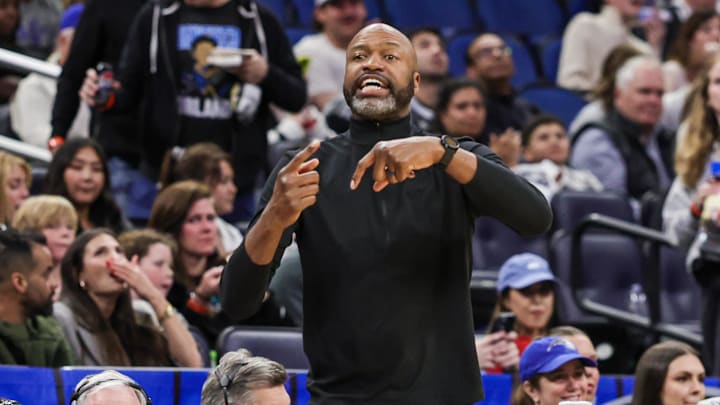 Orlando Magic head coach Jamahl Mosley motions to the court during the second half against the Memphis Grizzlies at Kia Center.