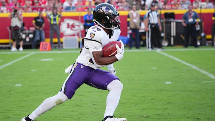 Sep 28, 2025; Kansas City, Missouri, USA; Baltimore Ravens running back Rasheen Ali (26) runs with the ball during the fourth quarter against the Kansas City Chiefs at GEHA Field at Arrowhead Stadium. Mandatory Credit: Denny Medley-Imagn Images