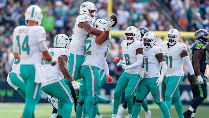 Miami Dolphins defensive tackle Zach Sieler (92) celebrates an interception during the third quarter against the Seattle Seahawks at Lumen Field. Miami Dolphins defensive tackle Zach Sieler (92) celebrates an interception during the third quarter against the Seattle Seahawks at Lumen Field.