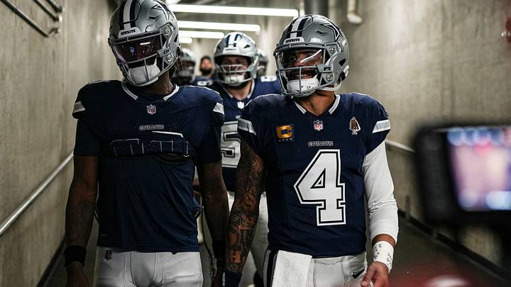 Dallas Cowboys quarterback Dak Prescott right, walks down the tunnel for warmup at Ford Field in Detroit.