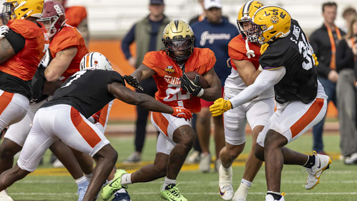 Jan 28, 2025; Mobile, AL, USA; American team running back RJ Harvey of UCF (22) runs the ball during Senior Bowl practice for the American team at Hancock Whitney Stadium. Mandatory Credit: Vasha Hunt-Imagn Images
