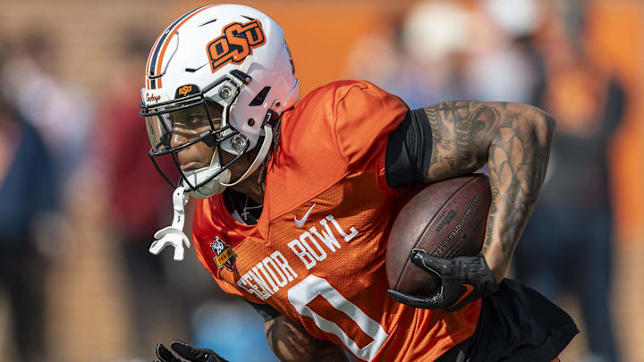 Jan 29, 2025; Mobile, AL, USA; National team running back Ollie Gordon II of Oklahoma State (0) runs the ball during Senior Bowl practice for the National team at Hancock Whitney Stadium. Mandatory Credit: Vasha Hunt-Imagn Images
