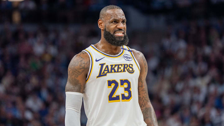Los Angeles Lakers forward LeBron James (23) talks with a referee in the third quarter against the Minnesota Timberwolves during game four of first round for the 2025 NBA Playoffs at Target Center. 