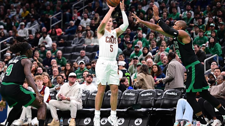 Nov 19, 2024; Boston, Massachusetts, USA; Cleveland Cavaliers guard Sam Merrill (5) shoots the ball while Boston Celtics center Al Horford (42) defends during the second half at TD Garden. Mandatory Credit: Bob DeChiara-Imagn Images