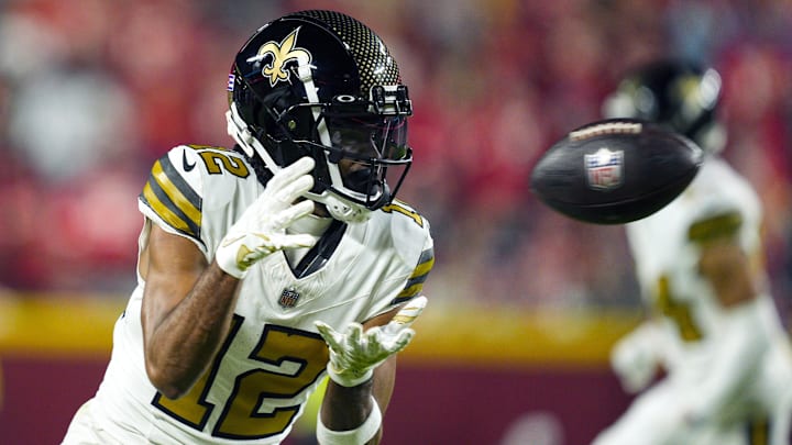 Oct 7, 2024; Kansas City, Missouri, USA; New Orleans Saints wide receiver Chris Olave (12) catches a pass during the second half against the Kansas City Chiefs at GEHA Field at Arrowhead Stadium. Mandatory Credit: Jay Biggerstaff-Imagn Images