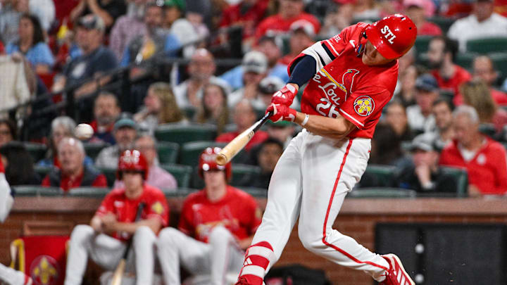 Apr 24, 2026; St. Louis, Missouri, USA; St. Louis Cardinals second baseman JJ Wetherholt (26) hits a single against the Seattle Mariners during the eighth inning at Busch Stadium. Mandatory Credit: Jeff Curry-Imagn Images