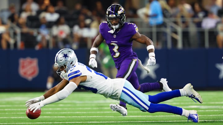 Sep 22, 2024; Arlington, Texas, USA; Dallas Cowboys cornerback C.J. Goodwin (29) recovers an onside kick in front Baltimore Ravens wide receiver Deonte Harty (3) during the second half at AT&T Stadium. Mandatory Credit: Kevin Jairaj-Imagn Images