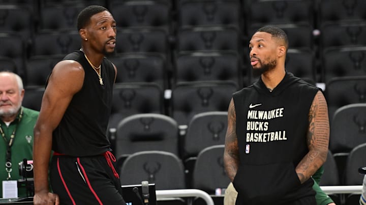 Oct 30, 2023; Milwaukee, Wisconsin, USA; Miami Heat center Bam Adebayo (13) greets Milwaukee Bucks guard Damian Lillard (0) before the game at Fiserv Forum. Mandatory Credit: Benny Sieu-Imagn Images