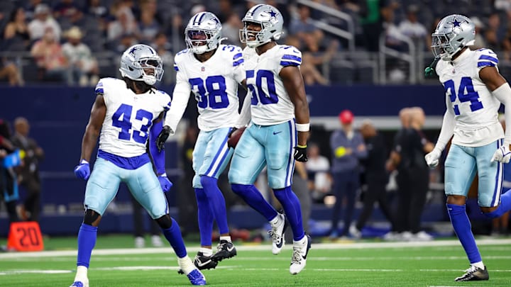 Dallas Cowboys LB Shemar James celebrates with teammates after a turnover during the second half against the Atlanta Falcons.