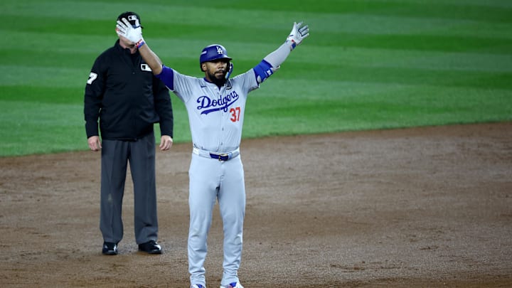 Oct 30, 2024; New York, New York, USA; Los Angeles Dodgers outfielder Teoscar Hernandez (37) celebrates after hitting a two-RBI double during the fifth inning against the New York Yankees in game five of the 2024 MLB World Series at Yankee Stadium. Mandatory Credit: Wendell Cruz-Imagn Images