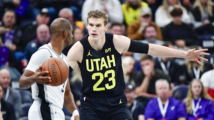 Nov 26, 2024; Salt Lake City, Utah, USA; San Antonio Spurs guard Chris Paul (3) dribbles the ball around Utah Jazz forward/center Lauri Markkanen (23) during the first half at the Delta Center. Mandatory Credit: Christopher Creveling-Imagn Images