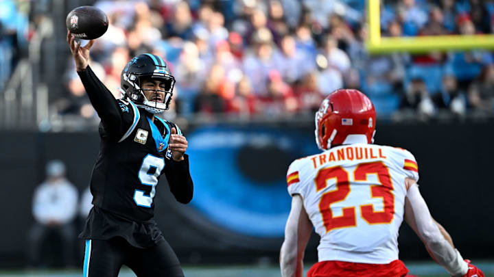 Nov 24, 2024; Charlotte, North Carolina, USA;  Carolina Panthers quarterback Bryce Young (9) passes the ball as Kansas City Chiefs linebacker Drue Tranquill (23) defends in the third quarter at Bank of America Stadium. Mandatory Credit: Bob Donnan-Imagn Images
