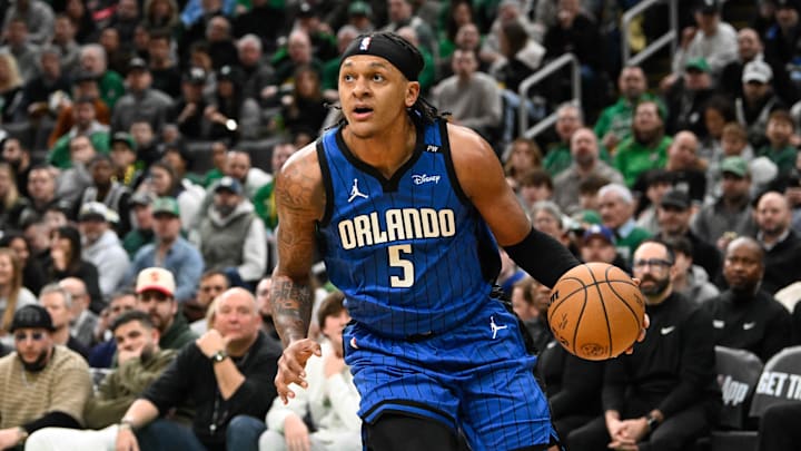 Jan 17, 2025; Boston, Massachusetts, USA; Orlando Magic forward Paolo Banchero (5) drives to the basket during the first half against the Boston Celtics at TD Garden. Mandatory Credit: Eric Canha-Imagn Images