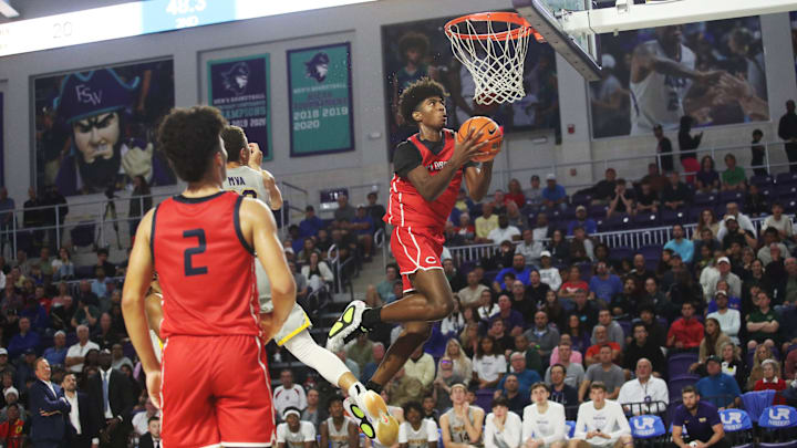 Jaxon Richardson of the Miami Columbus High School basketball team drives to the basket during the championship game against Montverde at the City of Palms Classic at Suncoast Credit Union Arena in Fort Myers on Monday, Dec. 23, 2024.