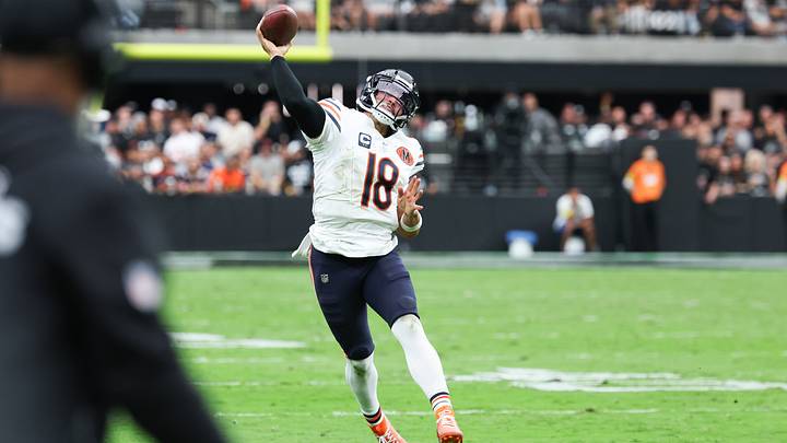 Bears quarterback Caleb Williams throws downfield after moving out of the pocket against the Raiders.