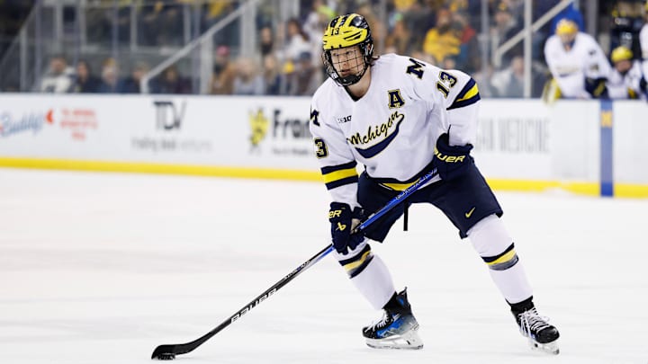 Mar 7, 2025; Ann Arbor, MI, USA; Michigan Wolverines forward T.J. Hughes (13) skates with the puck against Penn State during a Big Ten Tournament quarter final game at Yost Arena. Mandatory Credit: Rick Osentoski-Imagn Images Mar 7, 2025; Ann Arbor, MI, USA; Michigan Wolverines forward T.J. Hughes (13) skates with the puck against Penn State during a Big Ten Tournament quarter final game at Yost Arena. Mandatory Credit: Rick Osentoski-Imagn Images