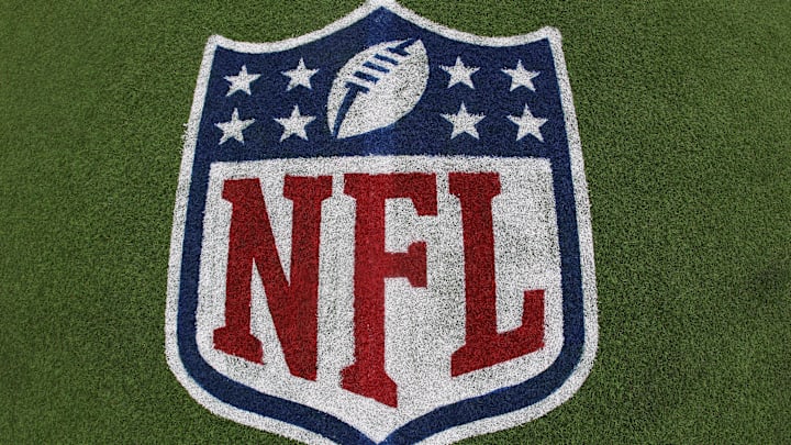 Jul 31, 2025; Canton, Ohio, USA;  General view of the NFL shield logo on the field at the Tom Benson Hall of Fame Stadium site of the Professional Football Hall of Fame game and Class of 2025 induction ceremonies. Mandatory Credit: Charles LeClaire-Imagn Images
