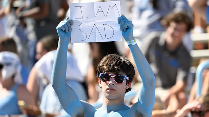 Oct 4, 2025; Chapel Hill, North Carolina, USA;  North Carolina Tar Heels fan holds up a sign in the second quarter at Kenan Stadium. Mandatory Credit: Bob Donnan-Imagn Images