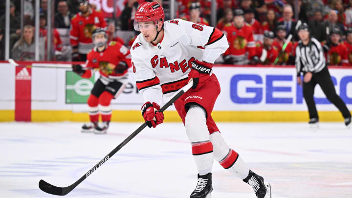 Apr 14, 2024; Chicago, Illinois, USA;  Carolina Hurricanes forward Martin Necas (88) controls the puck in the second period against the Chicago Blackhawks at United Center. Mandatory Credit: Jamie Sabau-USA TODAY Sports