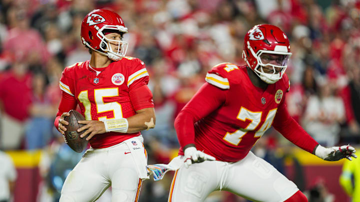 Oct 7, 2024; Kansas City, Missouri, USA; Kansas City Chiefs quarterback Patrick Mahomes (15) drops back to pass as offensive tackle Jawaan Taylor (74) gets ready to block during the first half against the New Orleans Saints at GEHA Field at Arrowhead Stadium. Mandatory Credit: Jay Biggerstaff-Imagn Images