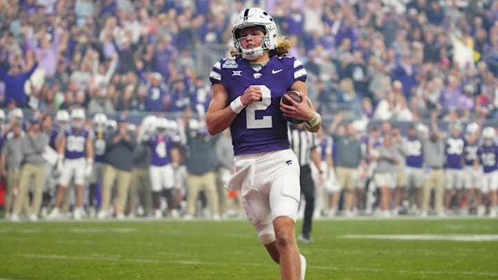 Kansas State quarterback Avery Johnson (2) scores a touchdown against Rutgers during first half of the Rate Bowl at Chase Field on Dec. 26, 2024, in Phoenix.