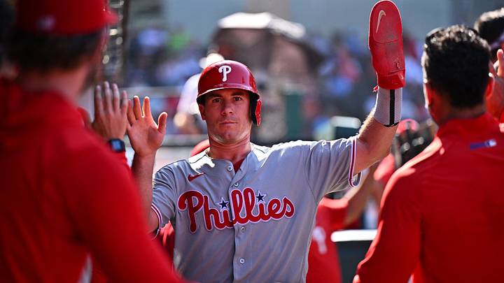 Aug 30, 2026; Anaheim, California, USA;  Philadelphia Phillies catcher J.T. Realmuto (10) is greeted by teammates after scoring during the ninth inning against the Los Angeles Angels at Angel Stadium.  Mandatory Credit: William Liang-Imagn Images