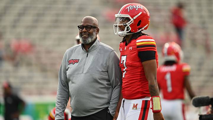 Maryland Terrapins head coach Michael Locksley talks with quarterback Malik Washington (7) during pre-game warm-ups before a game against the Northern Illinois Huskies at SECU Stadium. 