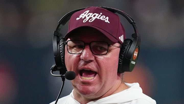 Dec 27, 2024; Las Vegas, NV, USA; Texas A&M Aggies head coach Mike Elko reacts against the Southern California Trojans in the second half at Allegiant Stadium. Mandatory Credit: Kirby Lee-Imagn Images Dec 27, 2024; Las Vegas, NV, USA; Texas A&M Aggies head coach Mike Elko reacts against the Southern California Trojans in the second half at Allegiant Stadium. Mandatory Credit: Kirby Lee-Imagn Images