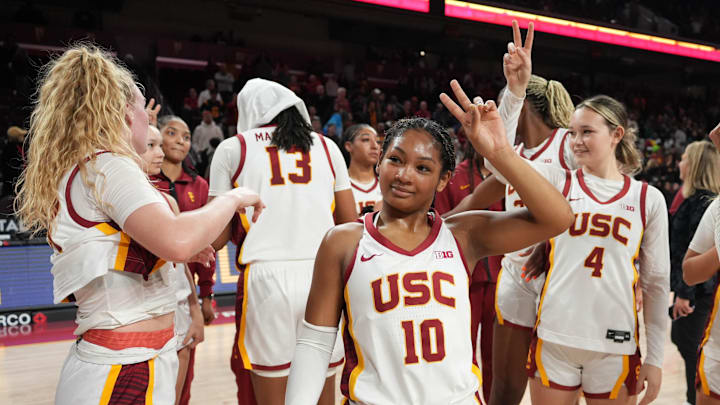 Dec 29, 2024; Los Angeles, California, USA; Southern California Trojans guard Malia Samuels (10) and guard Rian Forestier (4) display Fight On sign after the game against the Michigan Wolverines at Galen Center. Mandatory Credit: Kirby Lee-Imagn Images Dec 29, 2024; Los Angeles, California, USA; Southern California Trojans guard Malia Samuels (10) and guard Rian Forestier (4) display Fight On sign after the game against the Michigan Wolverines at Galen Center. Mandatory Credit: Kirby Lee-Imagn Images