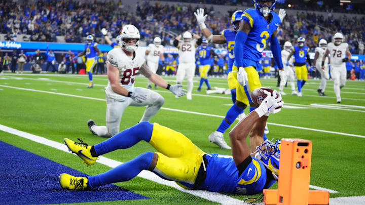 Dec 28, 2024; Inglewood, California, USA; Los Angeles Rams cornerback Ahkello Witherspoon (4) intercepts a pass with 42 seconds left against the Arizona Cardinals at SoFi Stadium. Mandatory Credit: Kirby Lee-Imagn Images