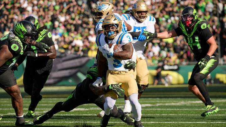 Oct 10, 2026; Eugene, Oregon, USA; UCLA Bruins running back Wayne Knight (3) carries the ball during the second half against Oregon Ducks linebacker Jerry Mixon (6) at Autzen Stadium. Mandatory Credit: Troy Wayrynen-Imagn Images