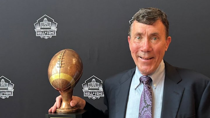 Longtime former Vikings equipment manager Dennis Ryan with his award from the Pro Football Hall of Fame.