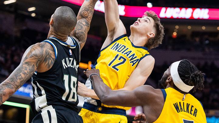 Nov 3, 2025; Indianapolis, Indiana, USA; Indiana Pacers guard Johnny Furphy (12) shoots against Milwaukee Bucks forward Kyle Kuzma (18) in the first half at Gainbridge Fieldhouse. Mandatory Credit: Trevor Ruszkowski-Imagn Images Nov 3, 2025; Indianapolis, Indiana, USA; Indiana Pacers guard Johnny Furphy (12) shoots against Milwaukee Bucks forward Kyle Kuzma (18) in the first half at Gainbridge Fieldhouse. Mandatory Credit: Trevor Ruszkowski-Imagn Images