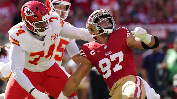 Oct 20, 2024; Santa Clara, California, USA; San Francisco 49ers defensive end Nick Bosa (97) looks up at the ball while being blocked by Kansas City Chiefs offensive tackle Jawaan Taylor (74) in the first quarter at Levi's Stadium. Mandatory Credit: Cary Edmondson-Imagn Images