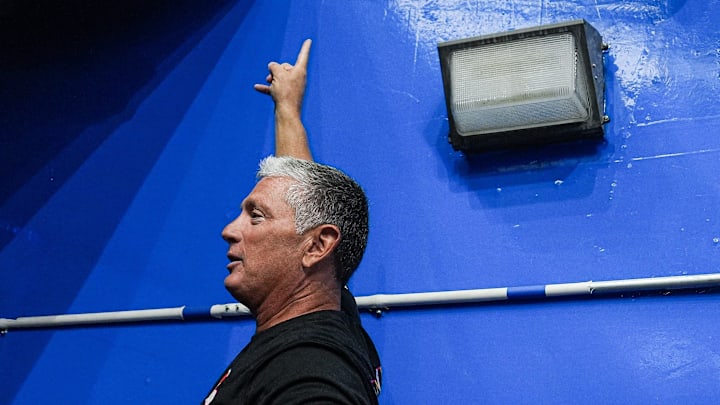 Cleveland Browns defensive coordinator Jim Schwartz takes a photo with fans before warm up ahead of the game between Detroit Lions and Cleveland Browns at Ford Field in Detroit on Sunday, Sept. 28, 2025.