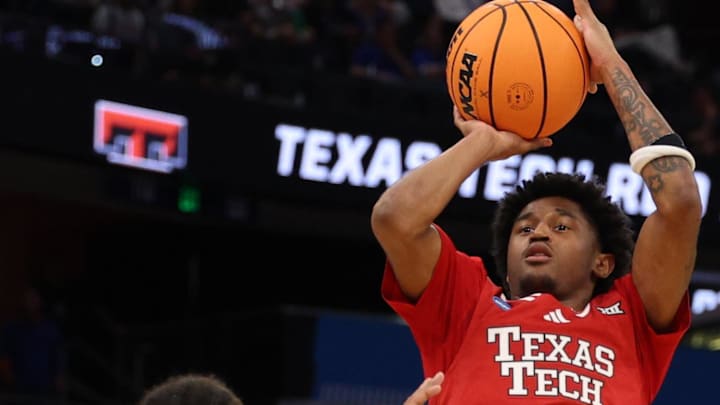 Mar 22, 2026; Tampa, FL, USA; Texas Tech Red Raiders guard Jaylen Petty (11) shoots over Alabama Crimson Tide guard Labaron Philon (0) in the first half during a second round game of the men's 2026 NCAA Tournament at Benchmark International Arena. Mandatory Credit: Nathan Ray Seebeck-Imagn Images