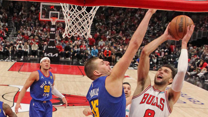 Chicago Bulls guard Zach LaVine (8) shoots over Denver Nuggets center Nikola Jokic (15) during the second half at United Center. Mandatory Credit: Dennis Wierzbicki-Imagn Images