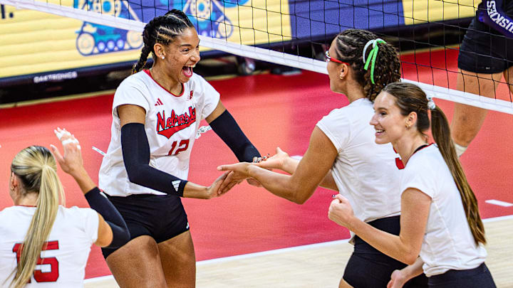 Taylor Landfair celebrates a block with Rebekah Allick. The Huskers have won 34 straight sets, including all 30 in Big Ten play. 