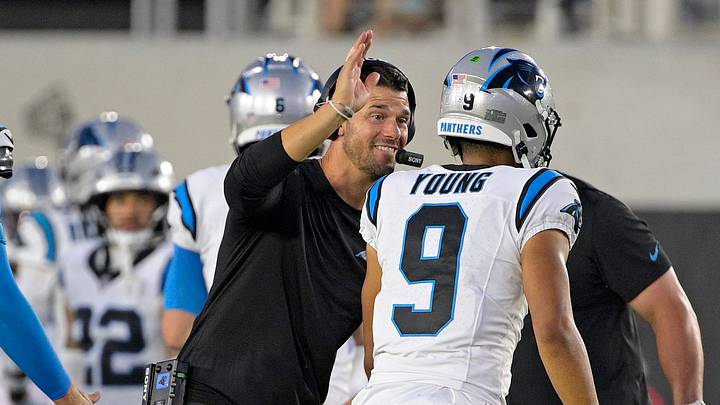 Carolina Panthers head coach Dave Canales celebrates with quarterback Bryce Young