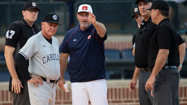 South Carolina Gamecocks head coach Paul Mainieri and Auburn Tigers head coach Butch Thompson talk with officials before the game as the Auburn Tigers take on South Carolina Gamecocks at Plainsman Park in Auburn, Ala., on Thursday, May 8, 2025.