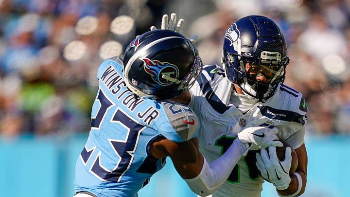 Tennessee Titans safety Kevin Winston Jr. (23) tries to stop Seattle Seahawks wide receiver Jaxon Smith-Njigba (11) during the second quarter at Nissan Stadium in Nashville, Tenn., Sunday, Nov. 23, 2025. Tennessee Titans safety Kevin Winston Jr. (23) tries to stop Seattle Seahawks wide receiver Jaxon Smith-Njigba (11) during the second quarter at Nissan Stadium in Nashville, Tenn., Sunday, Nov. 23, 2025.