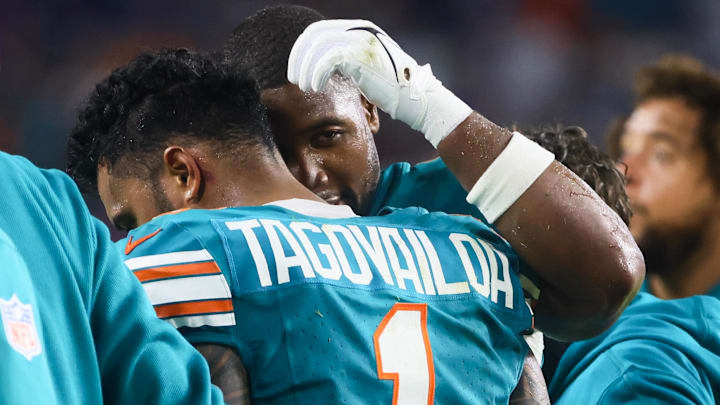 Sep 12, 2024; Miami Gardens, Florida, USA; Miami Dolphins quarterback Tua Tagovailoa (1) walks off the field after an apparent injury against the Buffalo Bills during the third quarter at Hard Rock Stadium. 