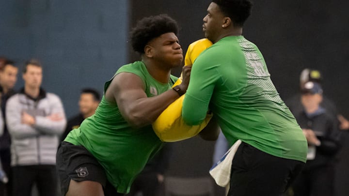 Oregon offensive lineman Josh Conerly Jr., left, runs drills with Oregon offensive lineman Marcus Harper II during the Oregon football’s Pro Day Tuesday, March 18, 2025, at the Moshofsky Center in Eugene, Ore.