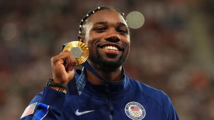 Aug 5, 2024: Noah Lyles celebrates with his gold medal at the victory ceremony for the men's 100m during the Paris 2024 Olympic Summer Games at Stade de France. Aug 5, 2024: Noah Lyles celebrates with his gold medal at the victory ceremony for the men's 100m during the Paris 2024 Olympic Summer Games at Stade de France.